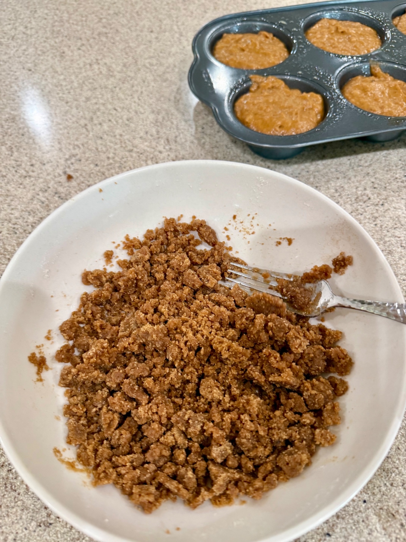 Homemade cinnamon crumble topping made with flour, brown sugar, cinnamon, salt, and butter.