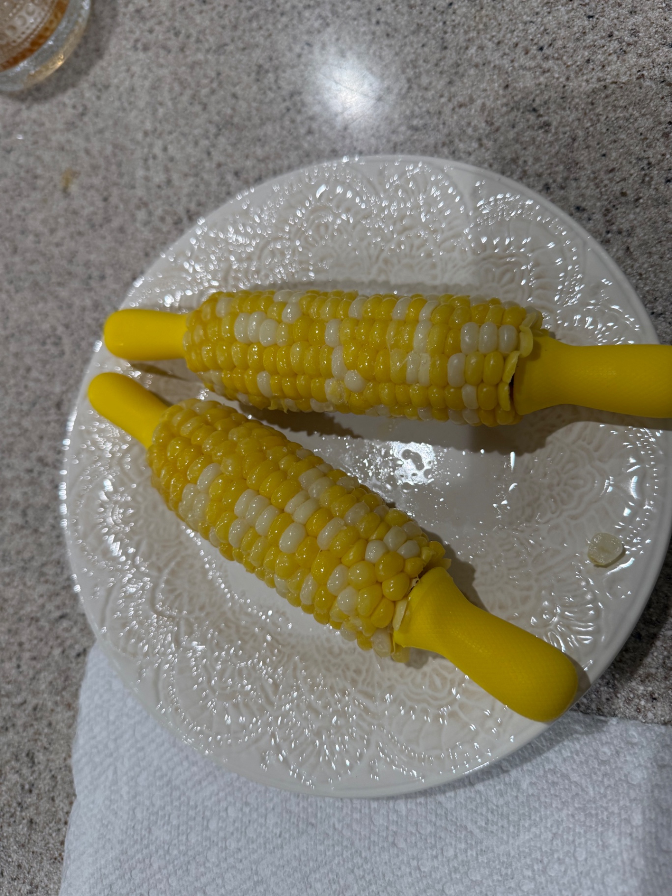 Freshly cooked sweet corn ears in a pot after blanching