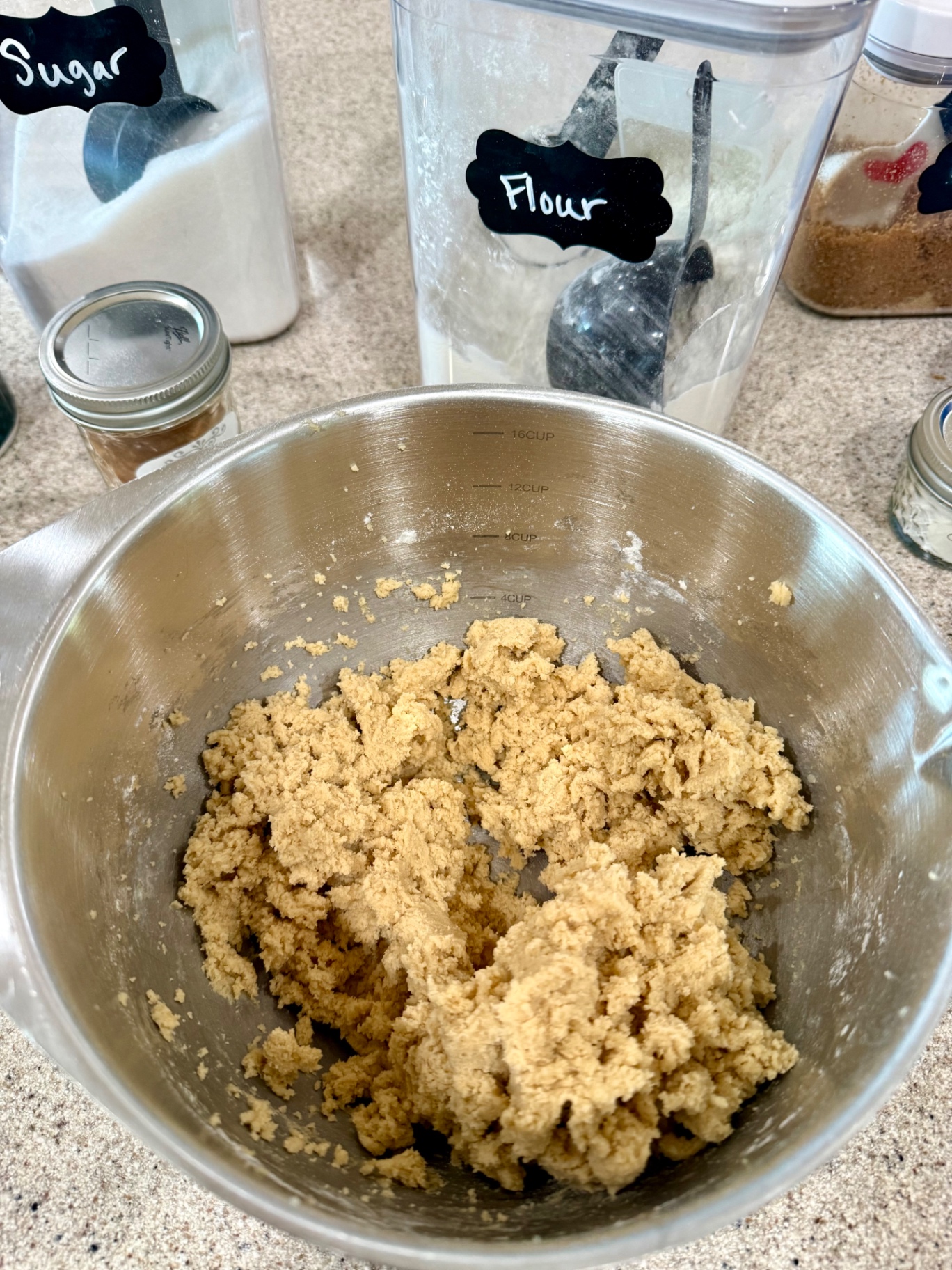 Finished snickerdoodle dough in a stainless steel mixing bowl.